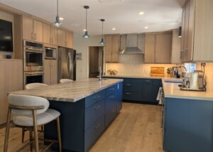Kitchen with island, blue cabinets, tile