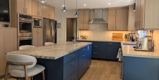 Kitchen with island, blue cabinets, tile