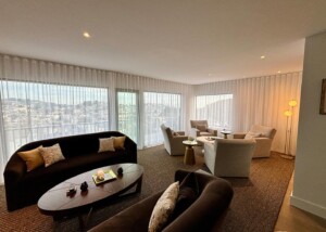 Living Room with Brown Couch and Grey Chairs