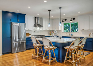 Sonoma Ranch Kitchen with Blue Cabinetry, Stainless Steel Appliances, Bold Geometric Tile
